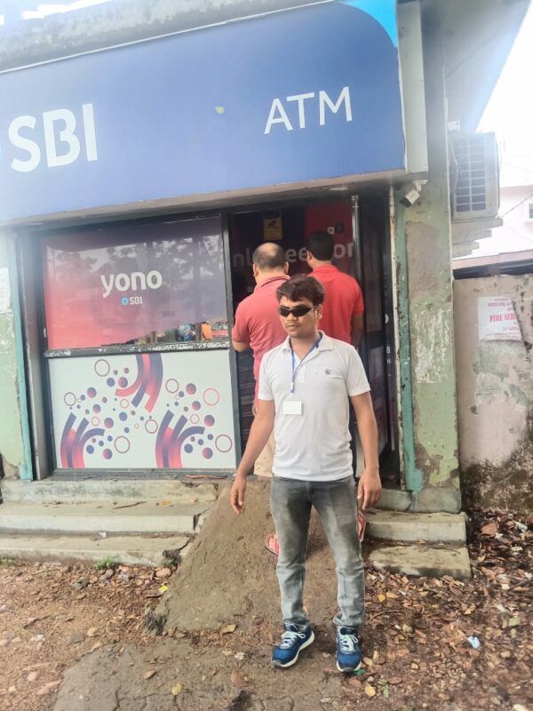 photo"BLT member in front of the ATM"